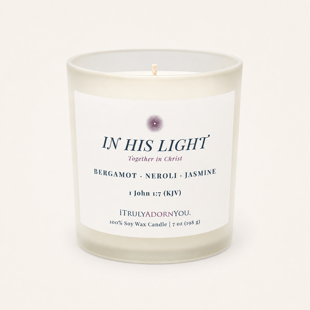 A frosted glass soy wax candle with a white label reading 'IN HIS LIGHT' and 'Bergamot - Neroli - Jasmine' by iTrulyAdornYou, photographed on a clean off-white background.