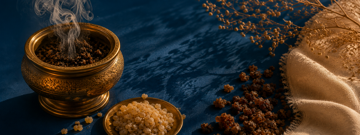 i Truly Adorn You One Accord fragrance image featuring frankincense and myrrh burning with smoke in a gold jar and also on the side of a blue surface